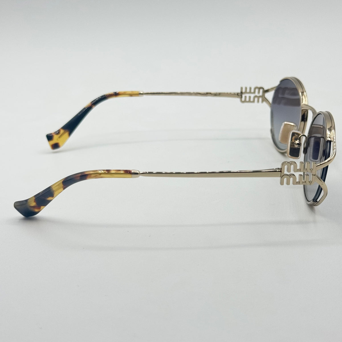 MiuMiu SMU 52Y — Fianco